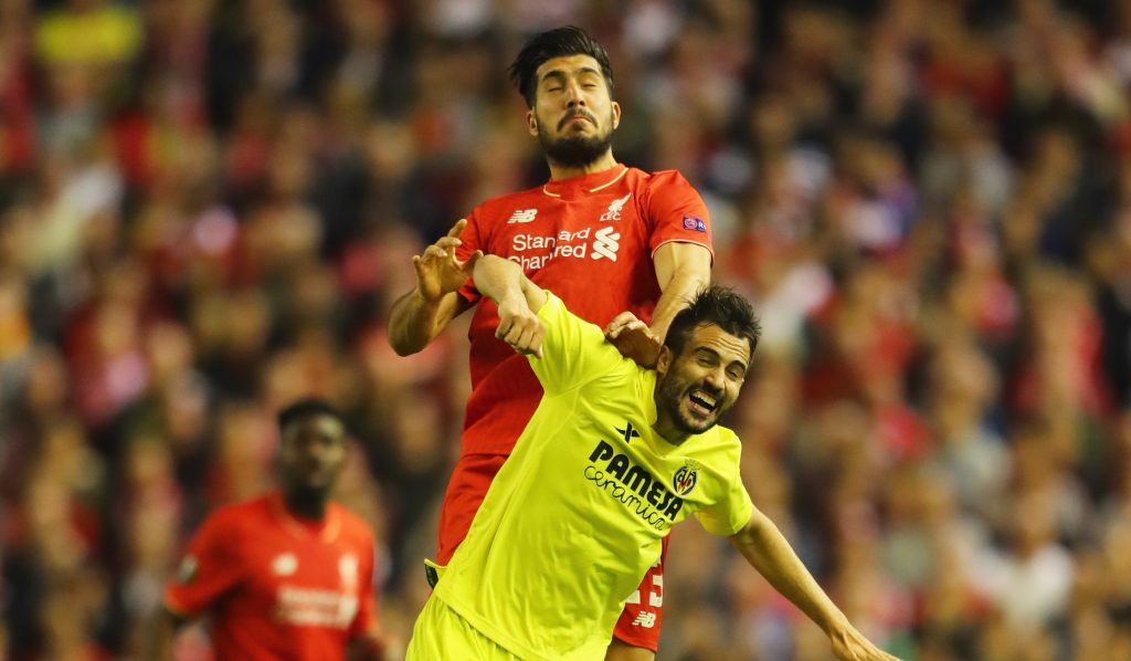 LIVERPOOL, UNITED KINGDOM - MAY 05: Emre Can of Liverpool outjumps Mario Gaspar of Villarreal during the UEFA Europa League semi final second leg match between Liverpool and Villarreal CF at Anfield on May 5, 2016 in Liverpool, England. (Photo by Richard Heathcote/Getty Images)
