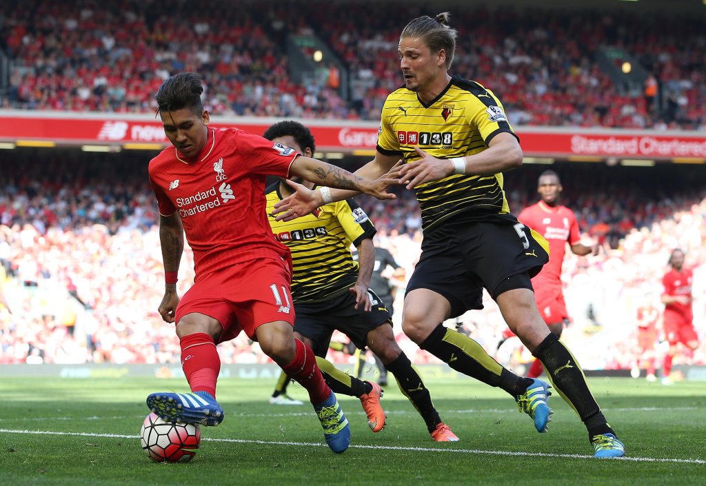 LIVERPOOL, ENGLAND - MAY 08: Roberto Firmino of Liverpool holds off Sebastian Prodl of Watford during the Barclays Premier League match between Liverpool and Watford at Anfield on May 8, 2016 in Liverpool, England. (Photo by Jan Kruger/Getty Images)