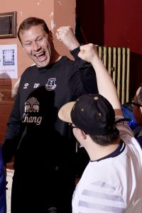 Ferguson cheers with fan and EITC participant